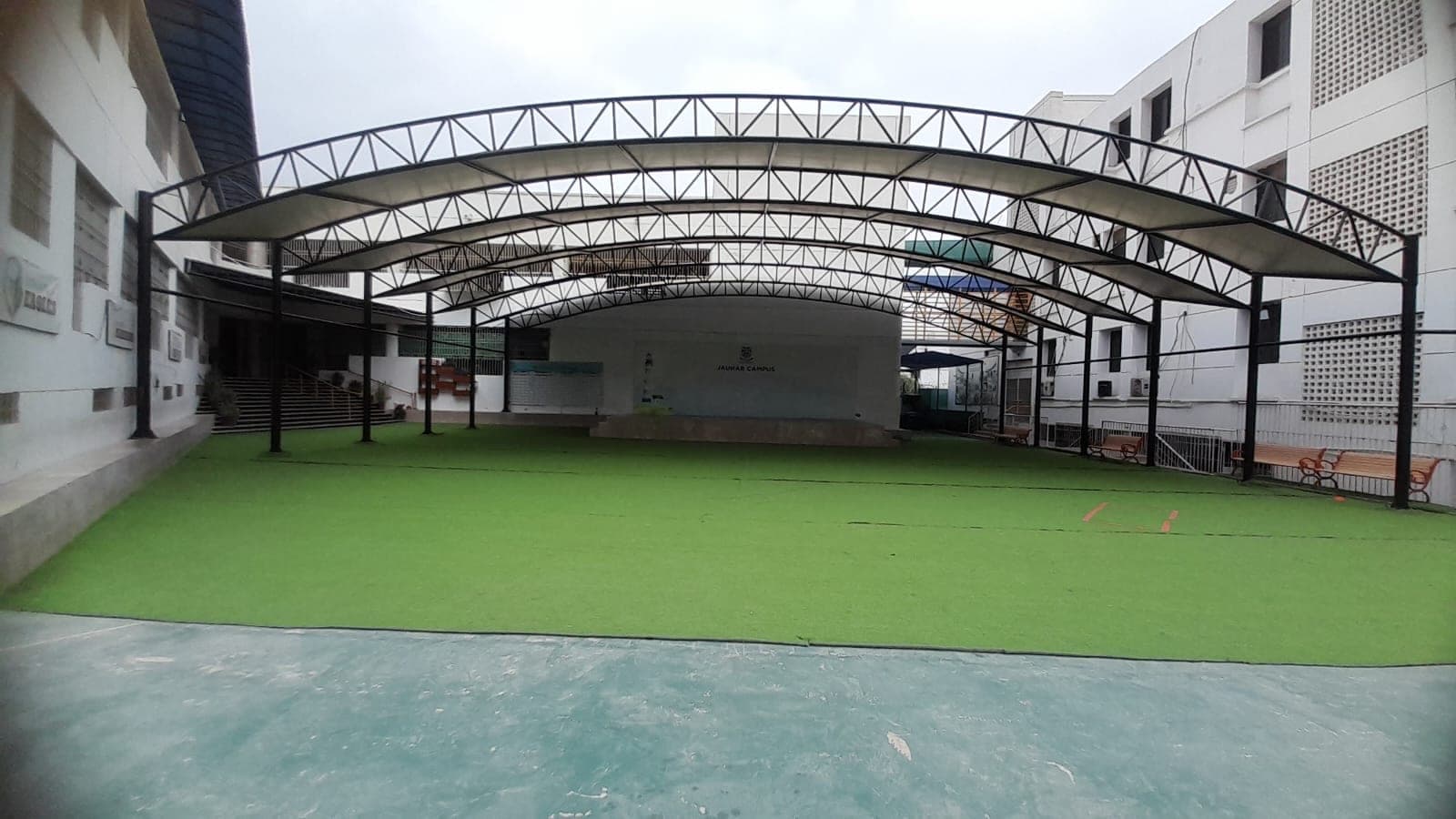 Arched steel framework and tensile canopy shed at Beaconhouse School Johar Campus Karachi