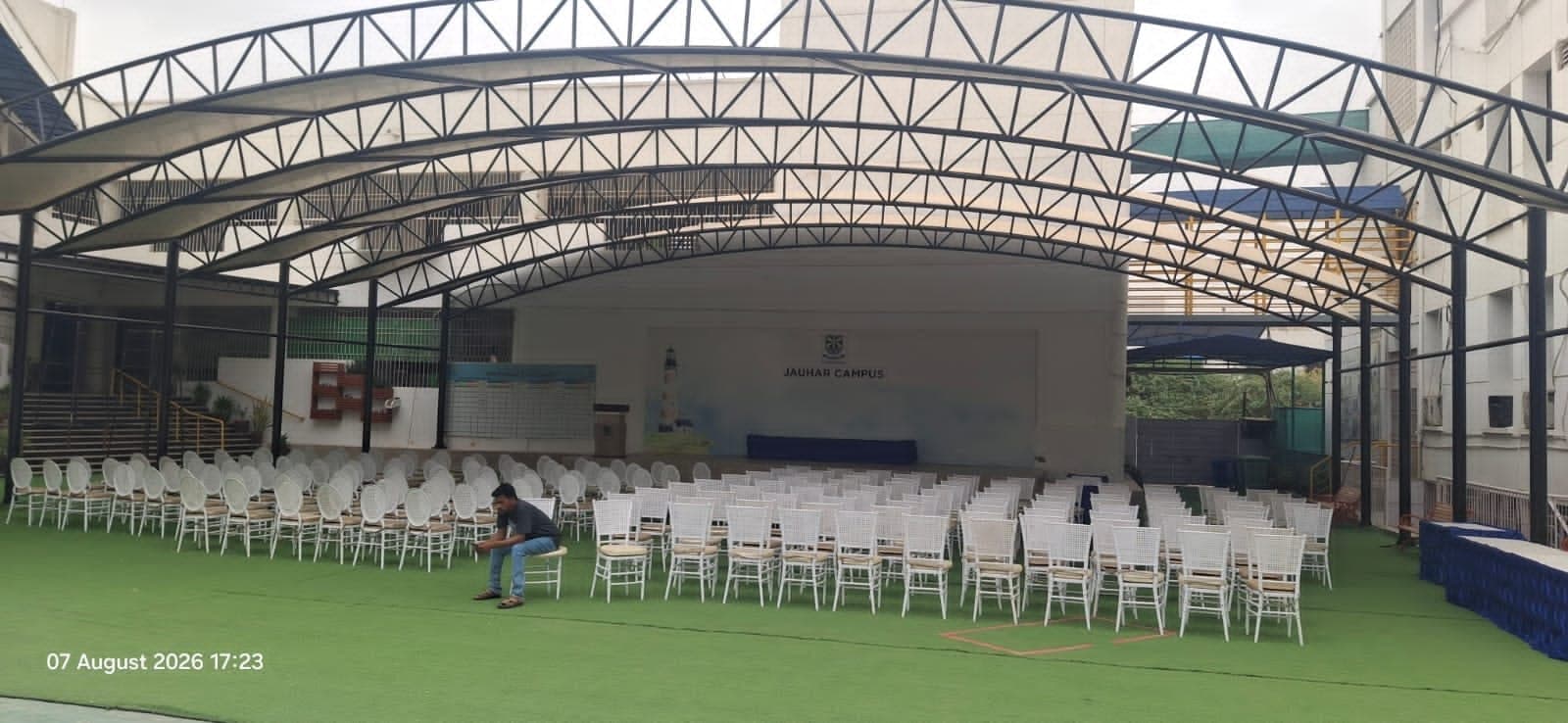 Wide-span canopy shed structure installed over school assembly ground at Beaconhouse Johar Campus Karachi