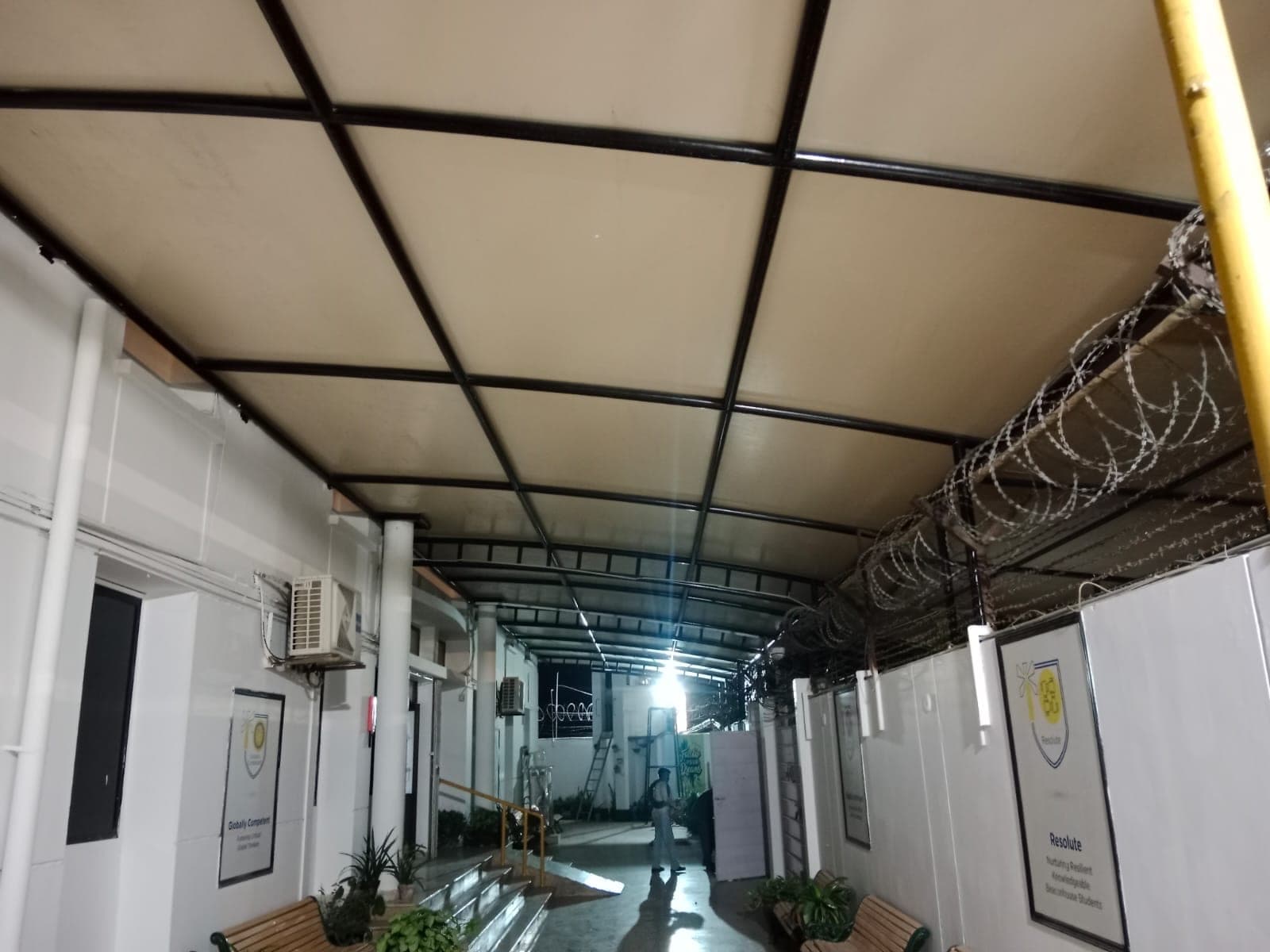 Side corridor canopy installation and perimeter steel anchoring at Beaconhouse Johar Campus