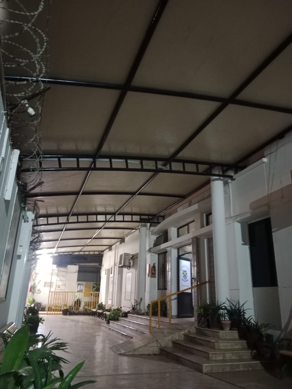 Illuminated night view of assembly area canopy shed installed at Beaconhouse Johar Campus Karachi