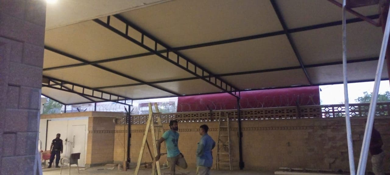Installation crew erecting 10,000 sq ft cantilever parking shed at SLM Tyres Nooriabad Jamshoro