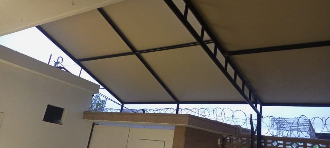 Heavy cantilever steel framework for industrial vehicle parking shed at SLM Tyres Nooriabad
