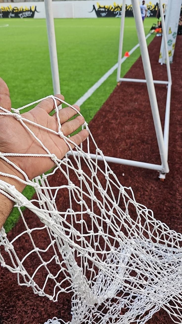 Heavy white braided nylon sports goal net ply and knots inspection