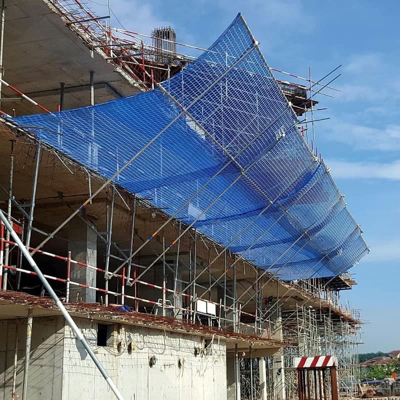 Cantilevered construction scaffolding safety net on high-rise building Karachi